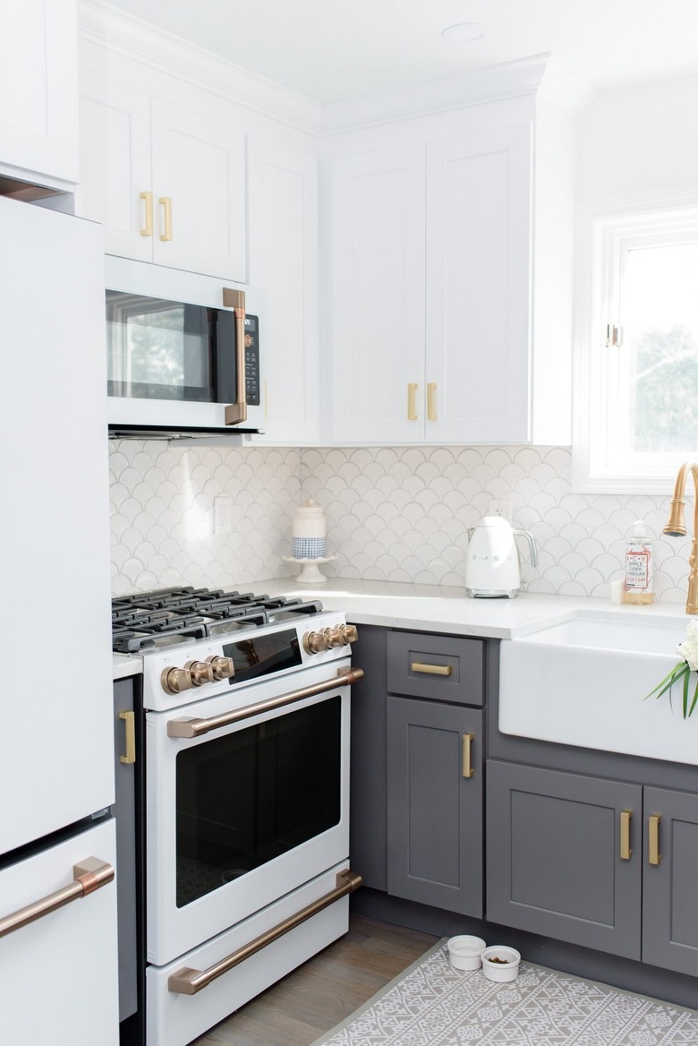 white and gray farmhouse kitchen with fish scale tile backsplash