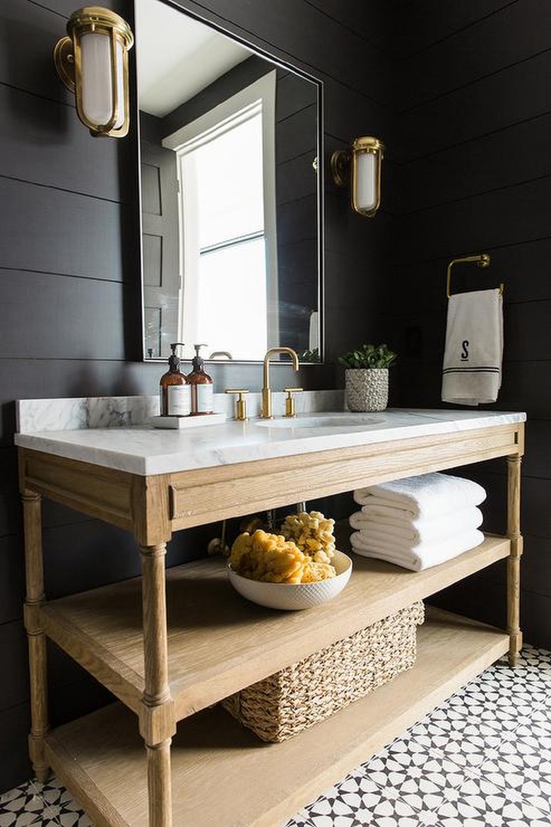 Black-and-white patterned tile and black walls