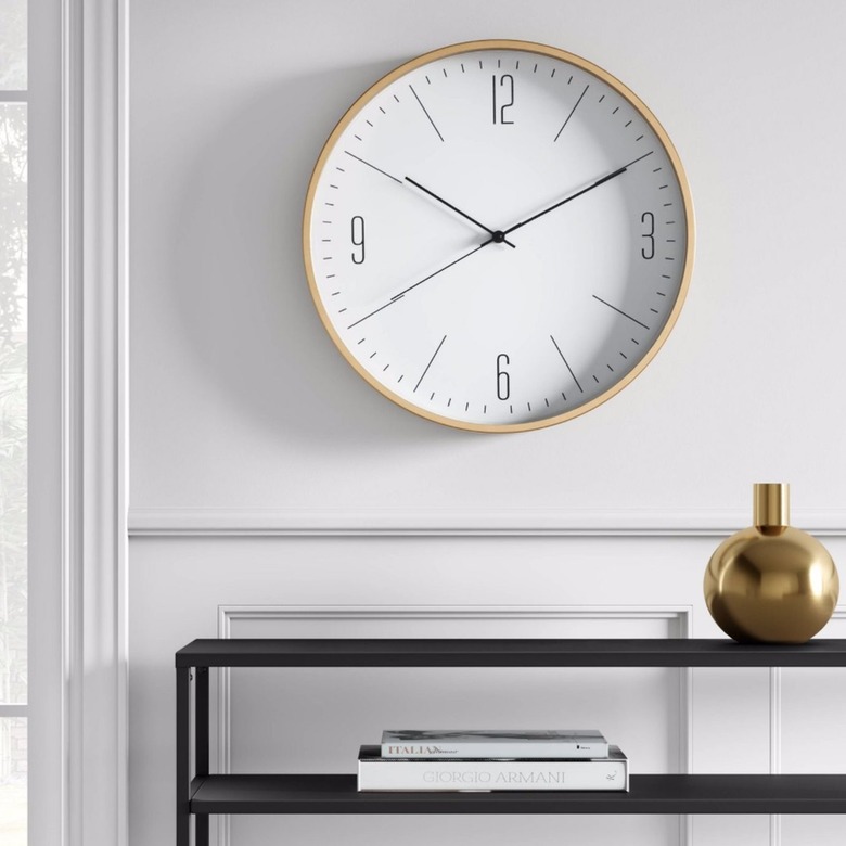 Wall clock, vase, tabe.