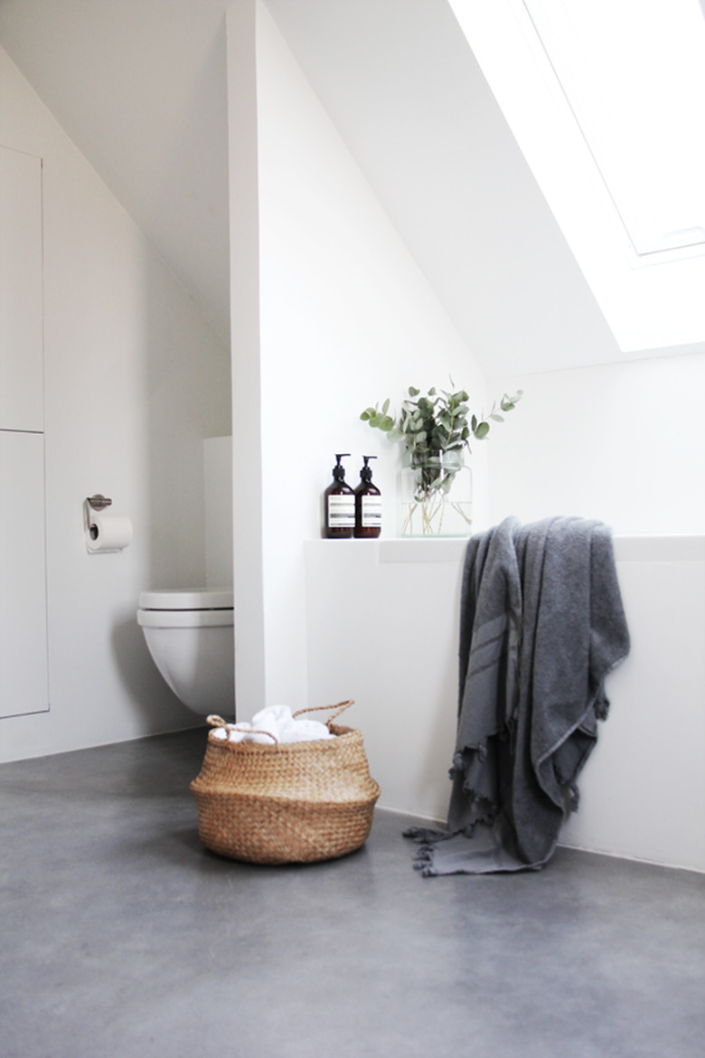 minimalist bathroom with concrete flooring