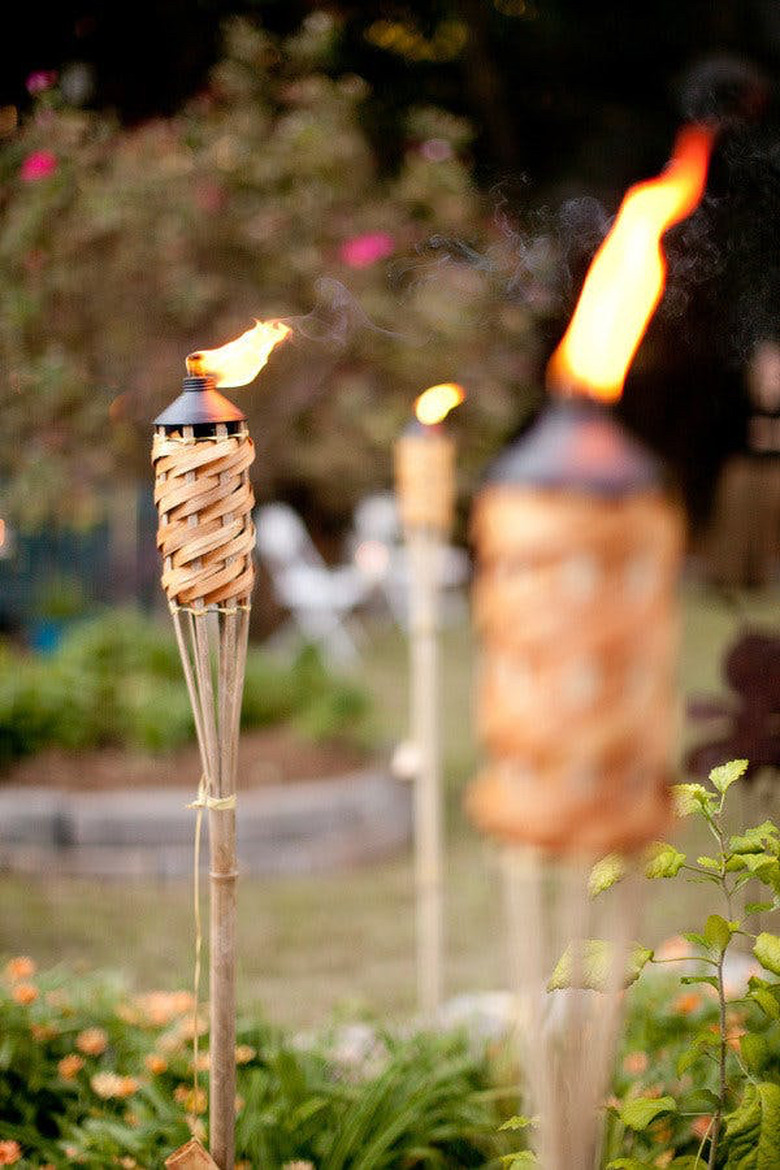 outdoor tiki torches in backyard