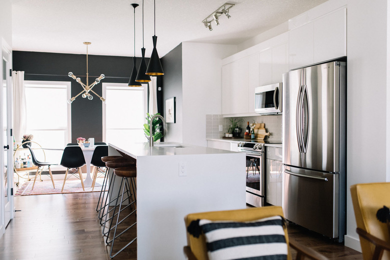 midcentury modern kitchen with pendant lighting above kitchen island