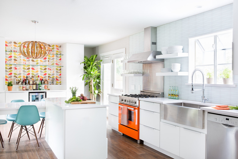 midcentury kitchen with orange stove