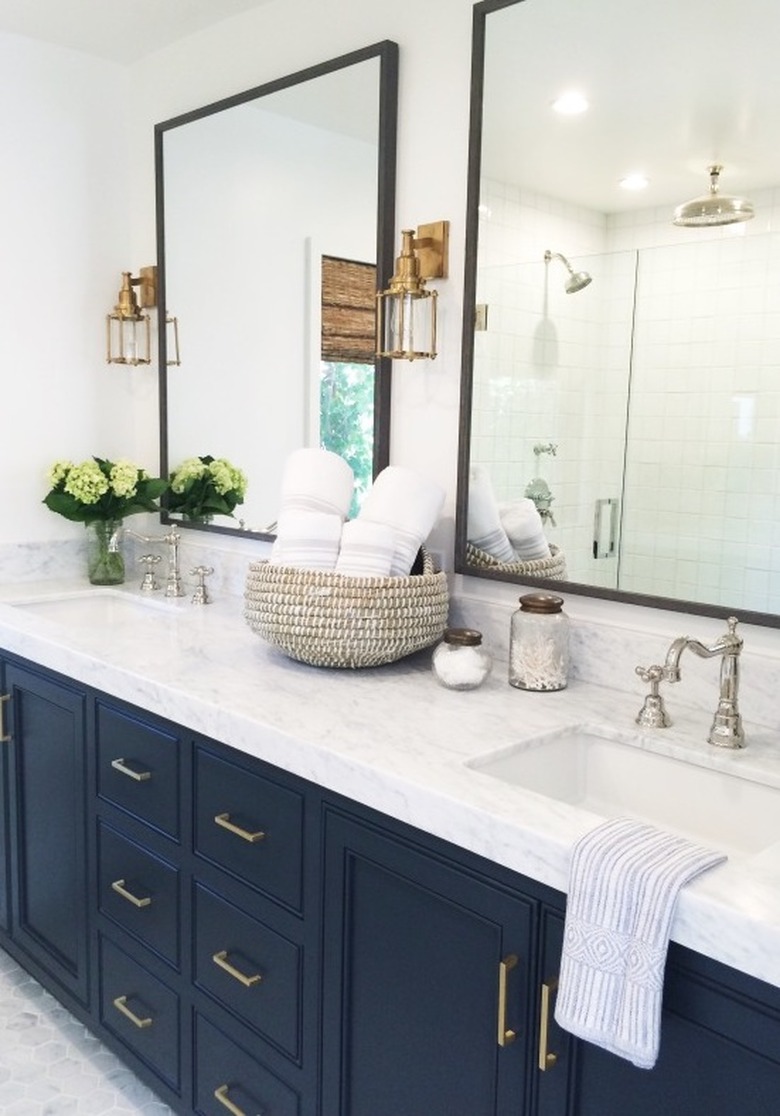 marble bathroom countertop with blue cabinets