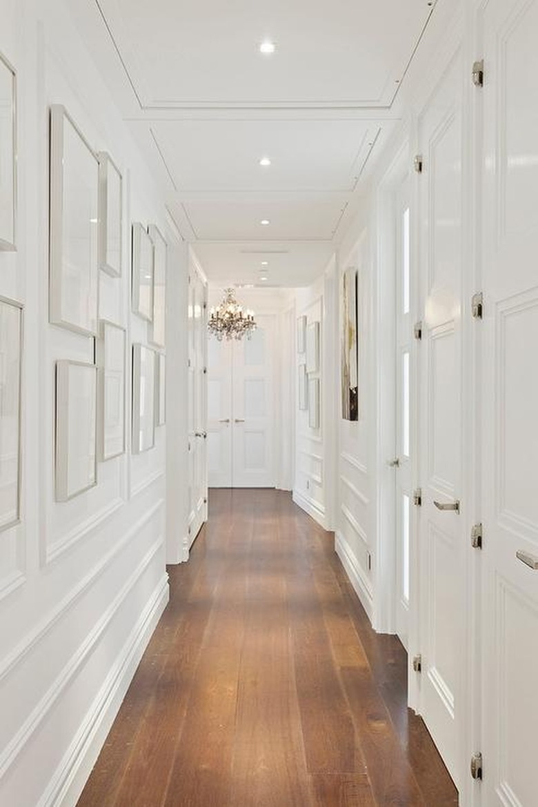 White hallway with molding