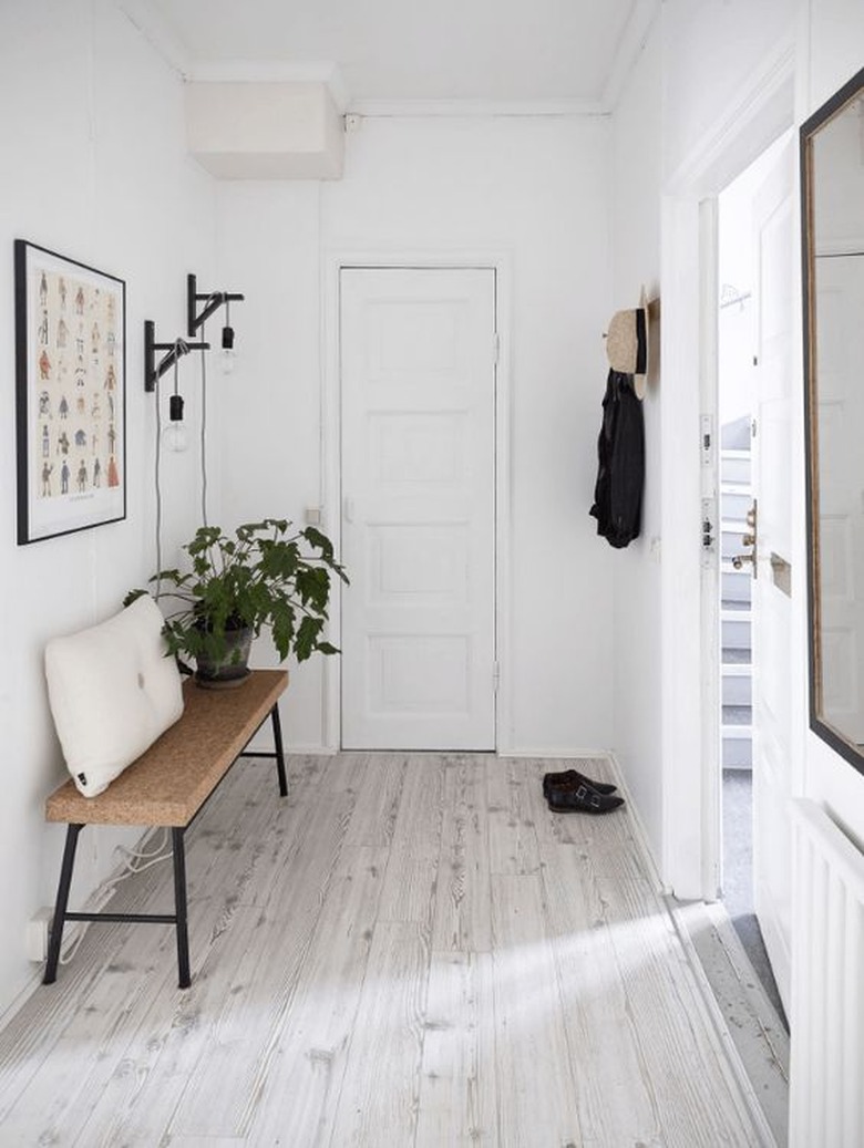 Hallway with white-washed floors