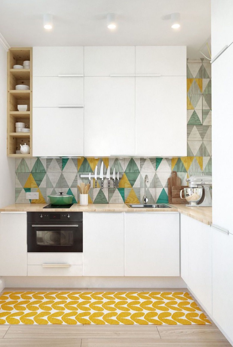 colorful L-shaped kitchen with white cabinets