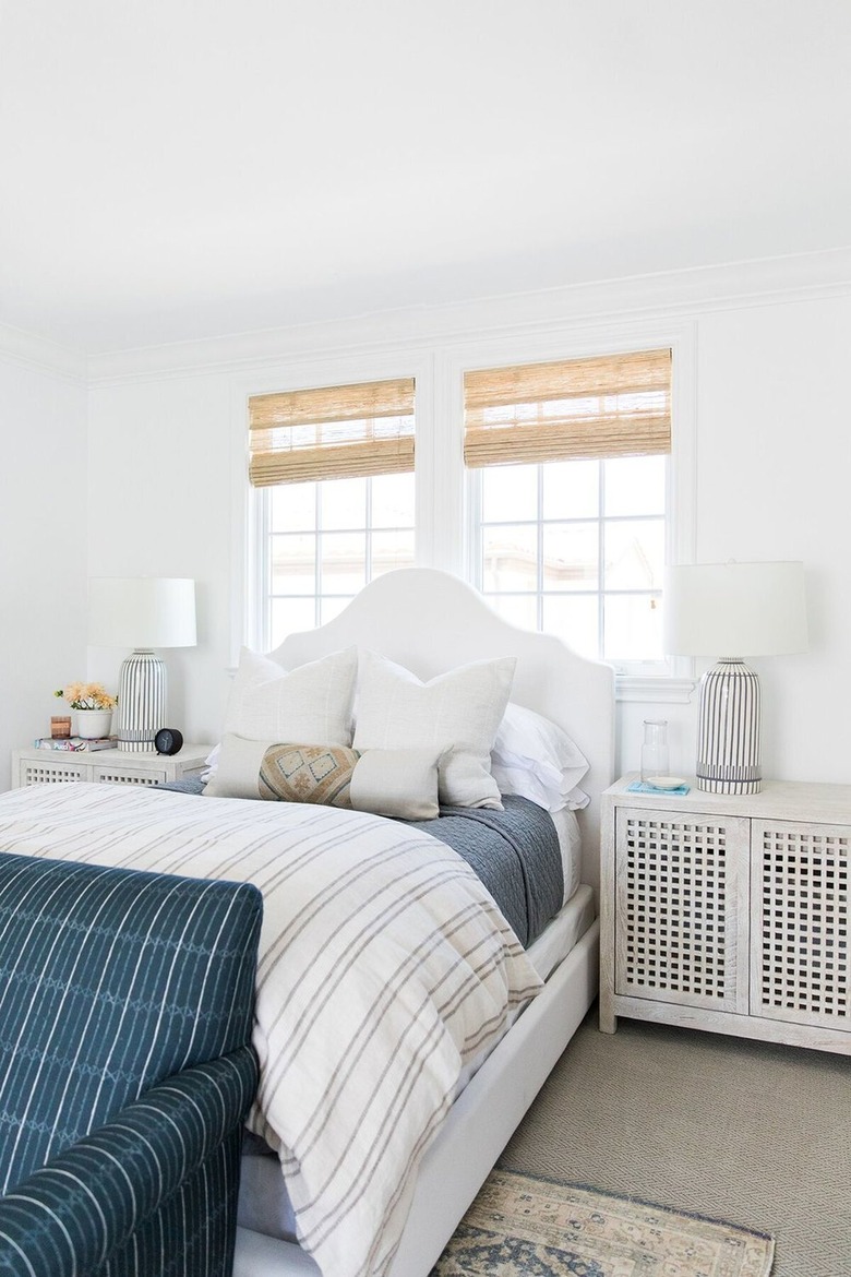 small bedroom storage idea: cabinets as bedside tables