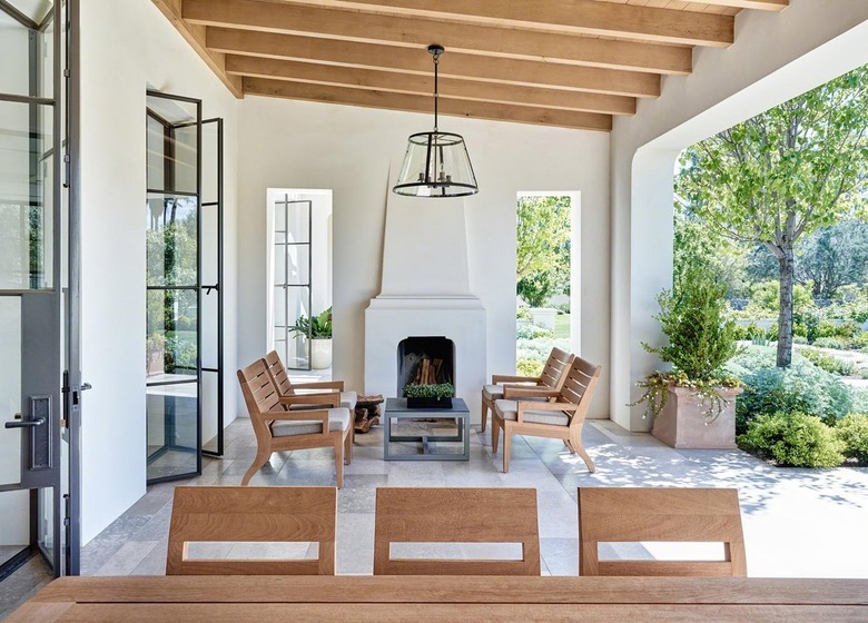 built-in closed roof patio cover with exposed wood beams