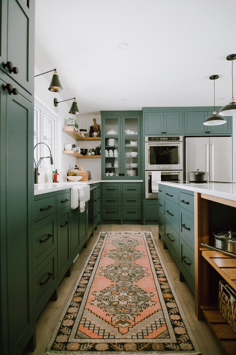 farmhouse style kitchen with green cabinets