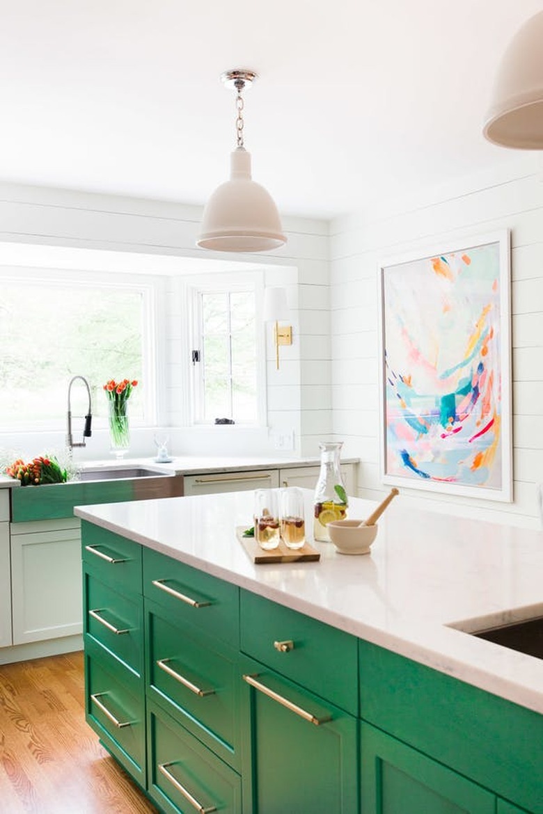 kitchen island with green cabinets