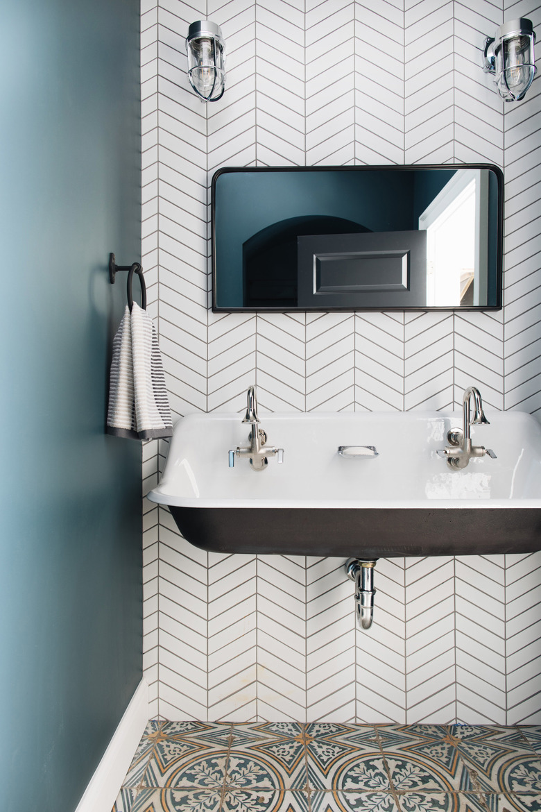 trough bathroom sink with with white herringbone wall tile