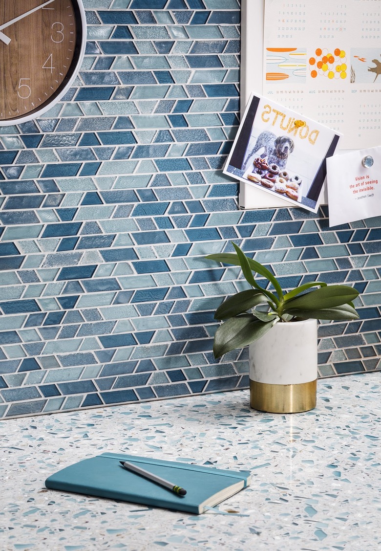 glass tile mosaic backsplash and terrazzo countertop in kitchen