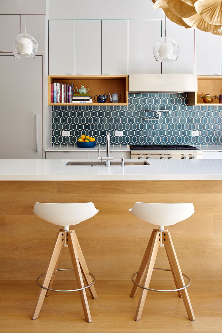 modern kitchen with teal tile backsplash