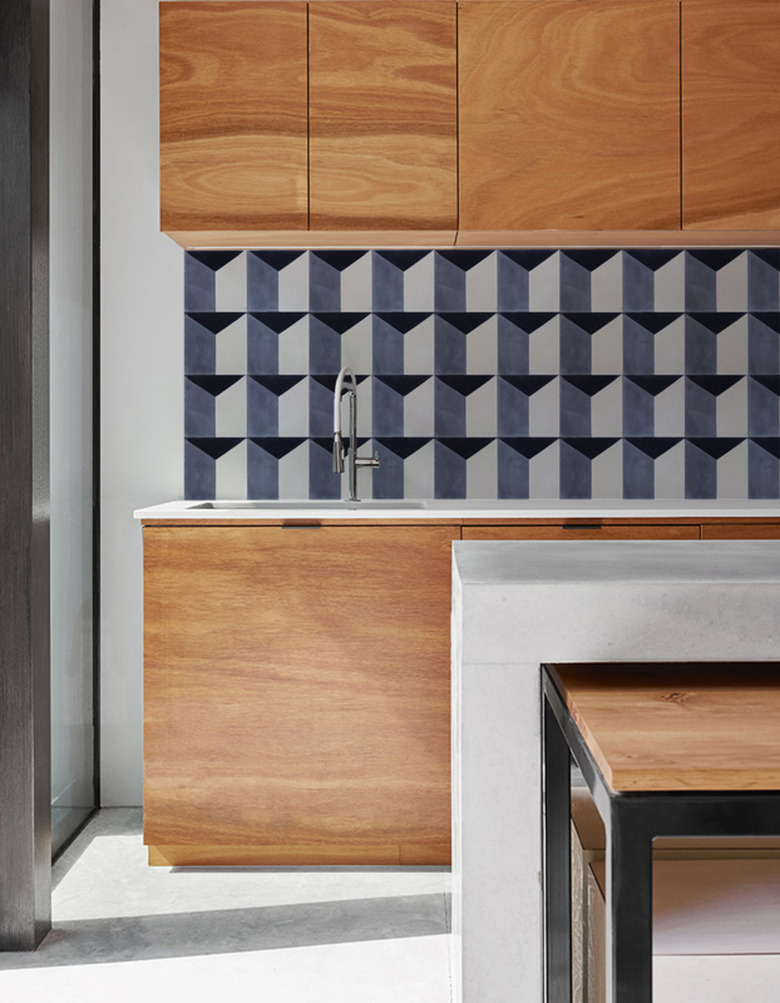 geometric pattern wallpaper backsplash in modern kitchen