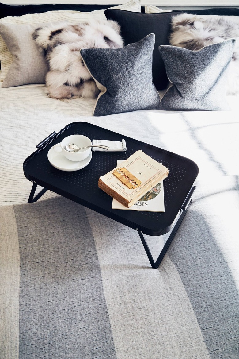 breakfast in bed with stainless steel tea strainer in cup