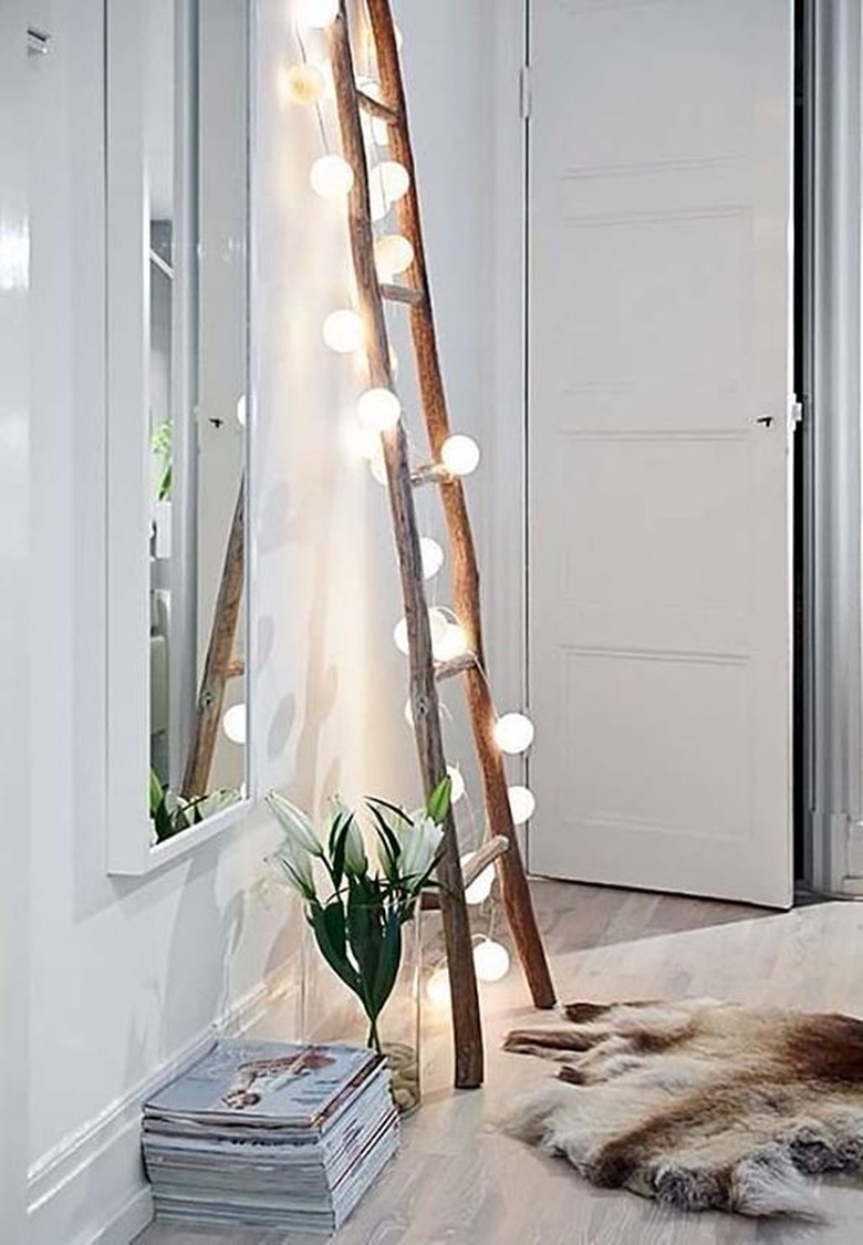 ladder with string lights