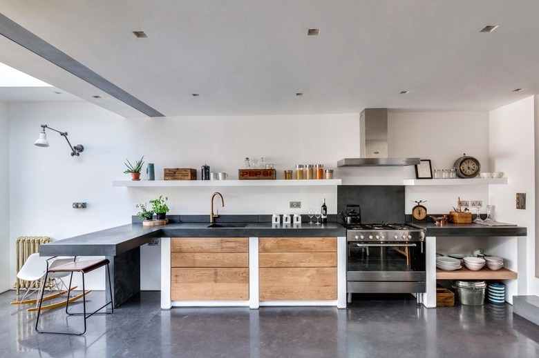 open kitchen with concrete flooring and wood accents