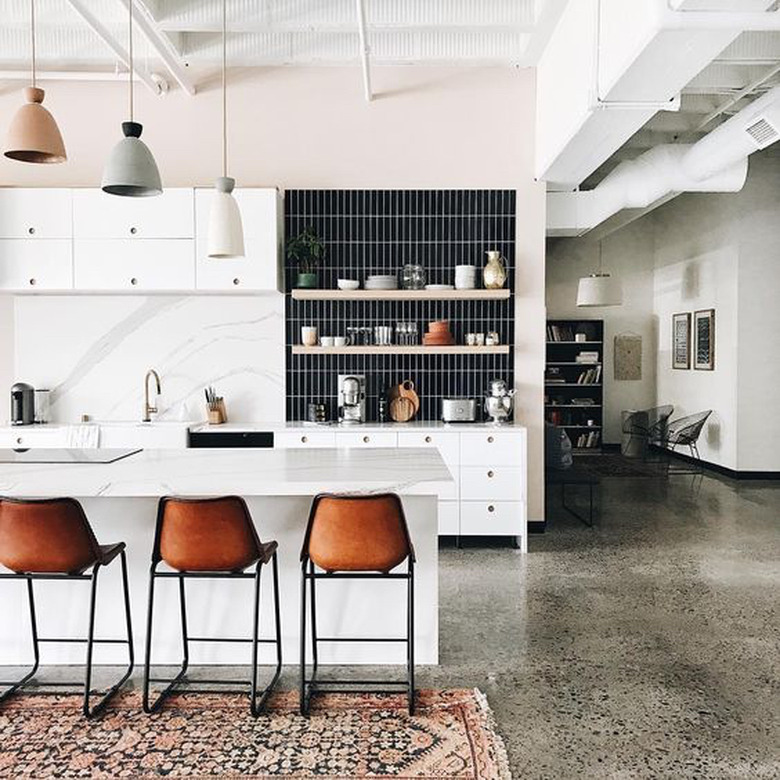 polished concrete kitchen floors in modern kitchen with area rug