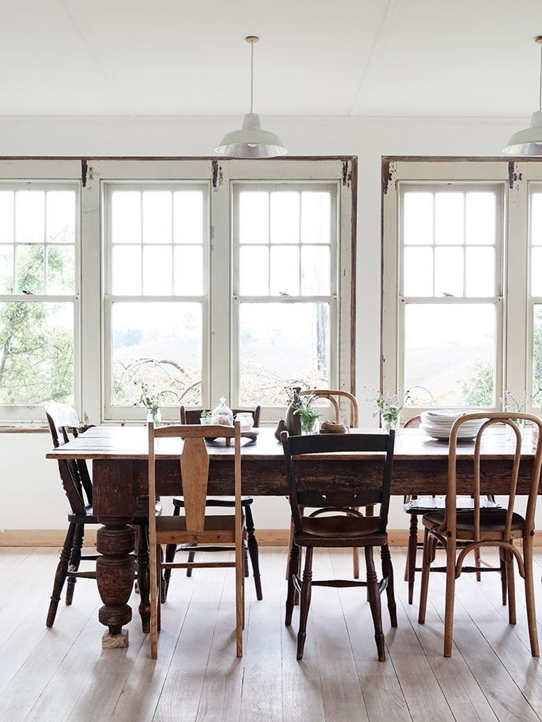 rustic dining room with mismatched chairs