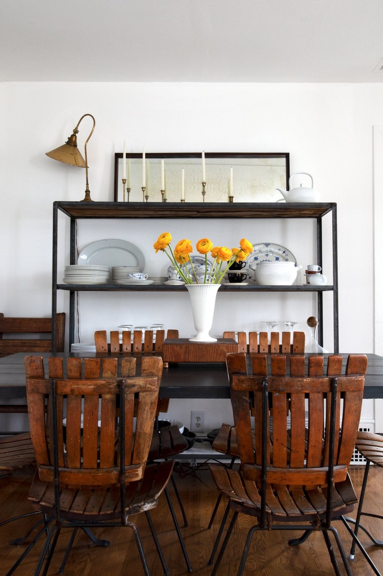 Dining room with dark farmhouse furniture and white walls