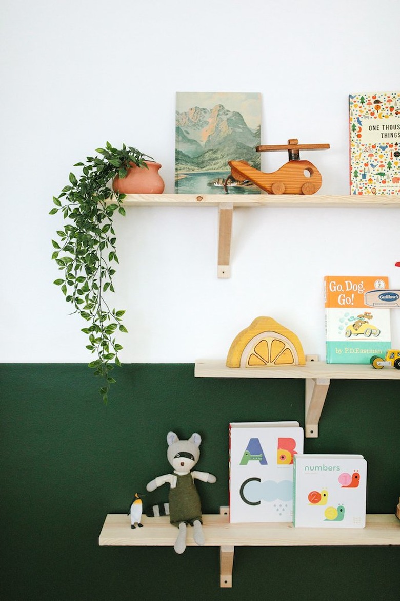 A shelving wall in hunter green and white