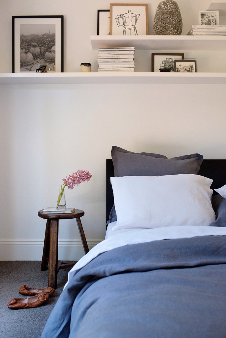 small bedroom with open shelving