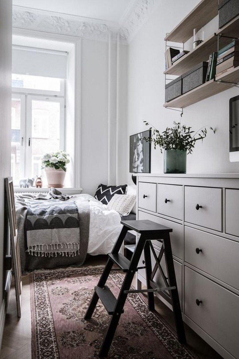 small bedroom with open shelving