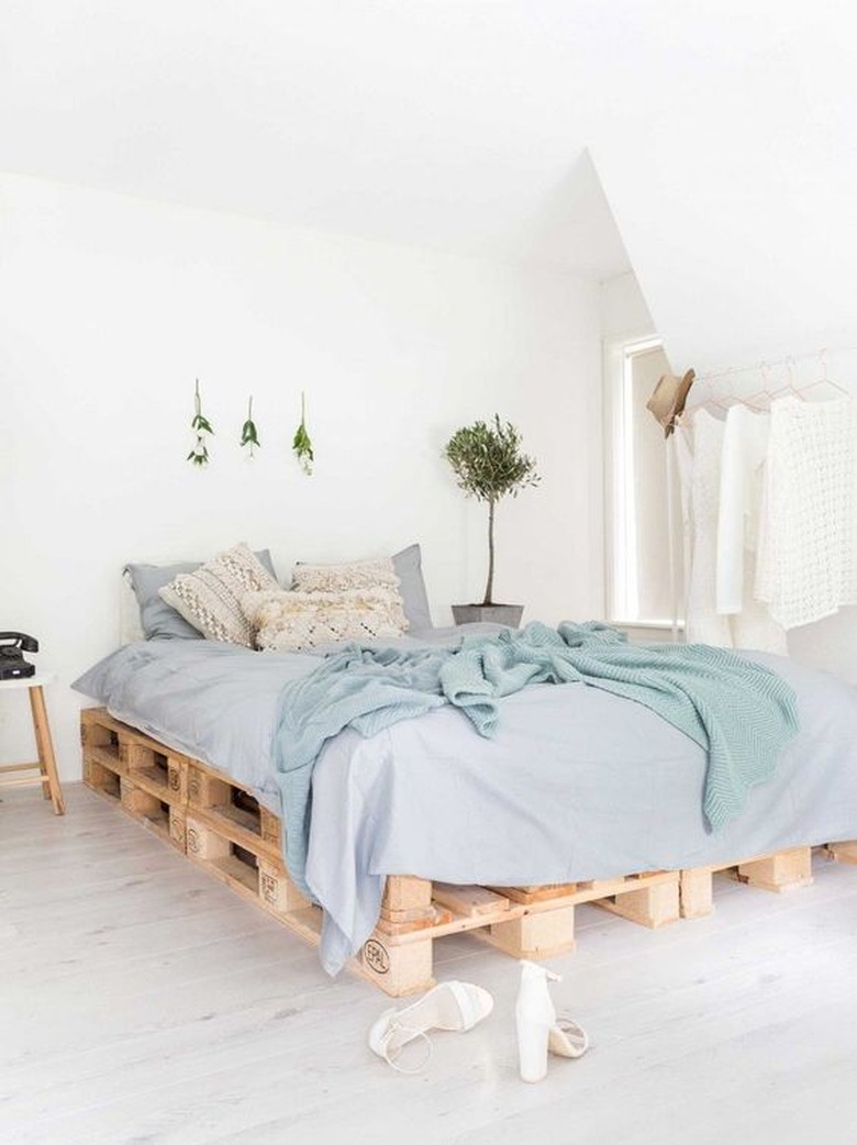 small bedroom with white wood flooring