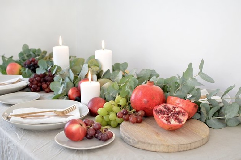 Eucalyptus leaves used as a table runner on set table