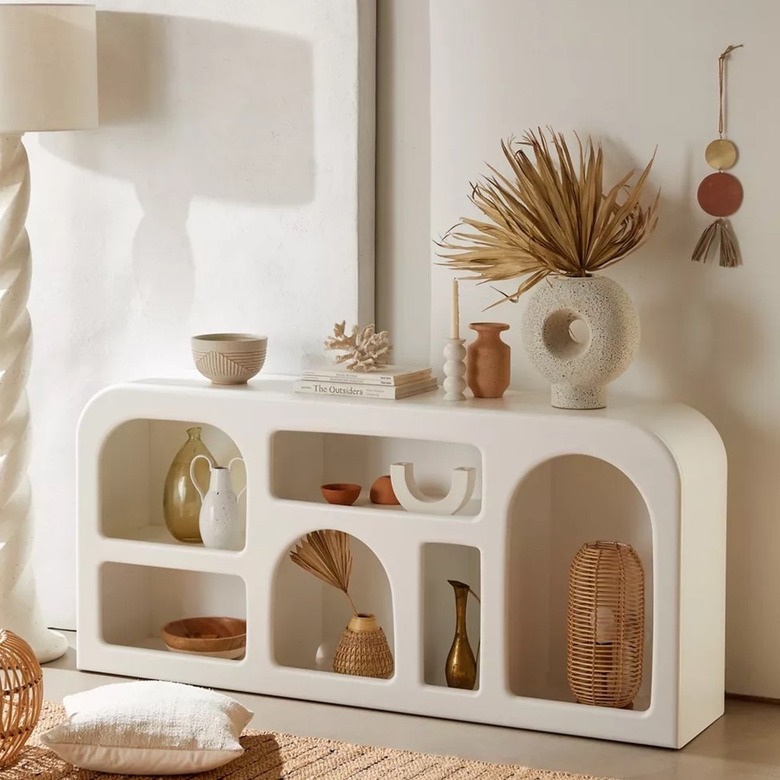 White storage piece with neutral accessories