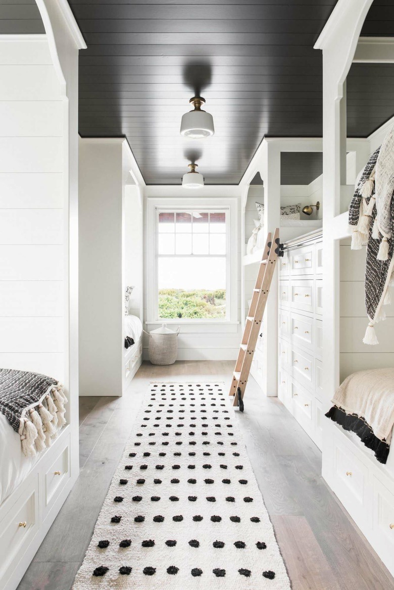 white and black bedroom with bunk beds