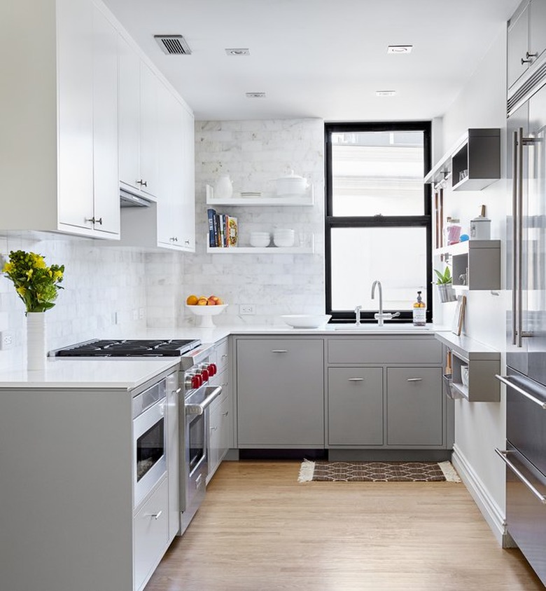 bright modern kitchen with black window frame and white marble