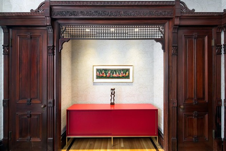 historic wooden design details and modern red sideboard