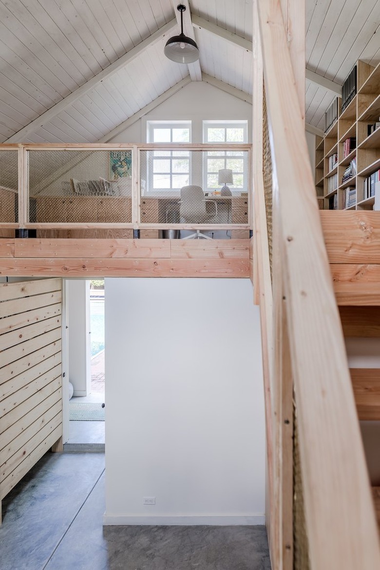 barn-style home with office and library in loft