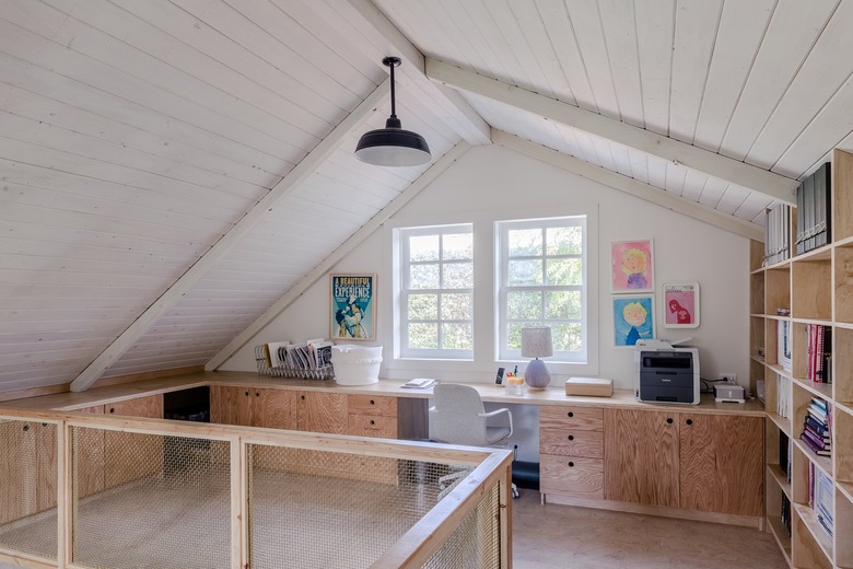 a modern plywood built-in home office in barn-style house