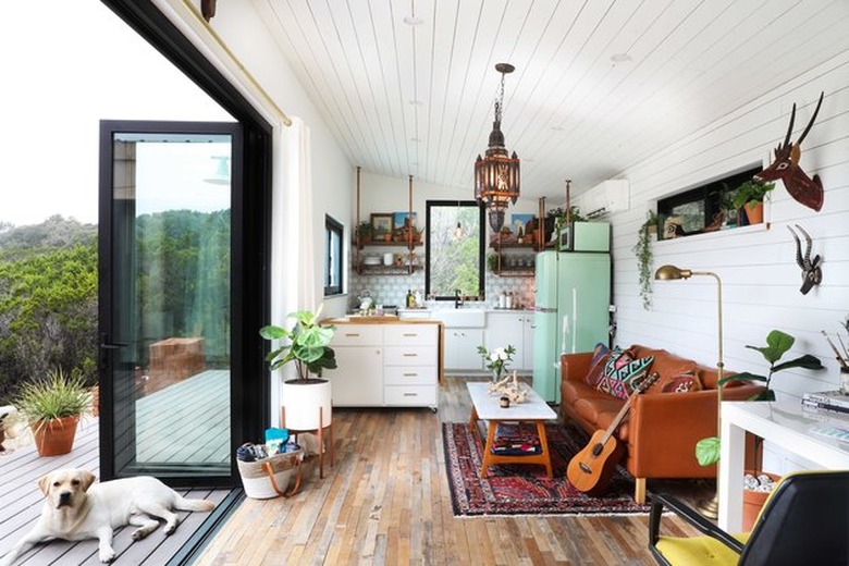 boho retreat kitchen living room concept with fold-up glass doors