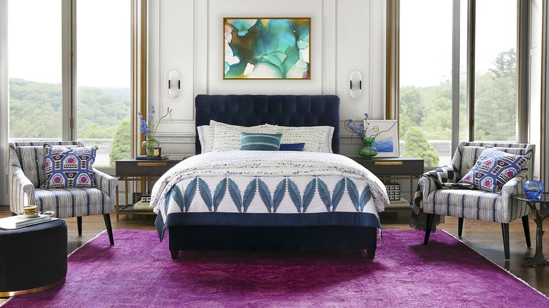 mixed pattern bedroom with purple rug