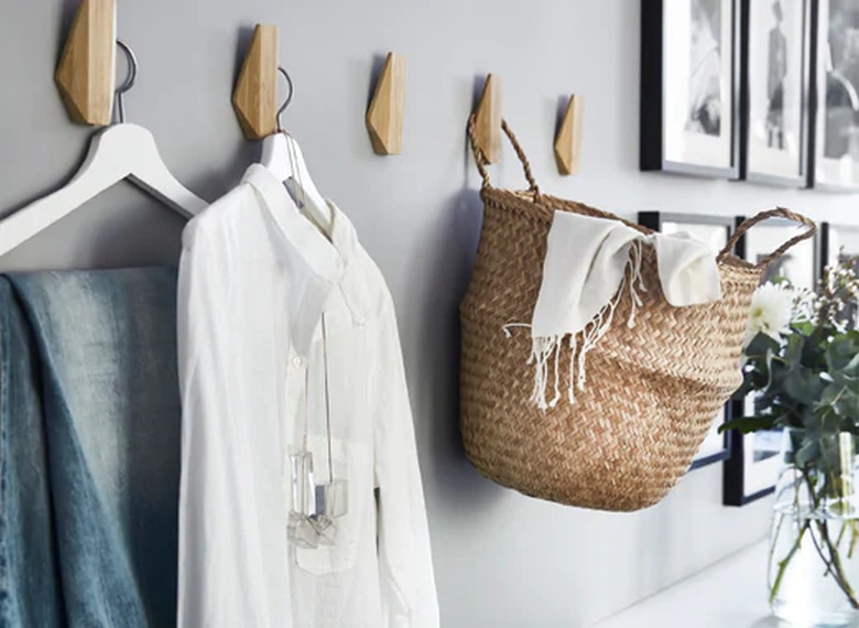 bedroom storage idea with wall hooks from IKEA