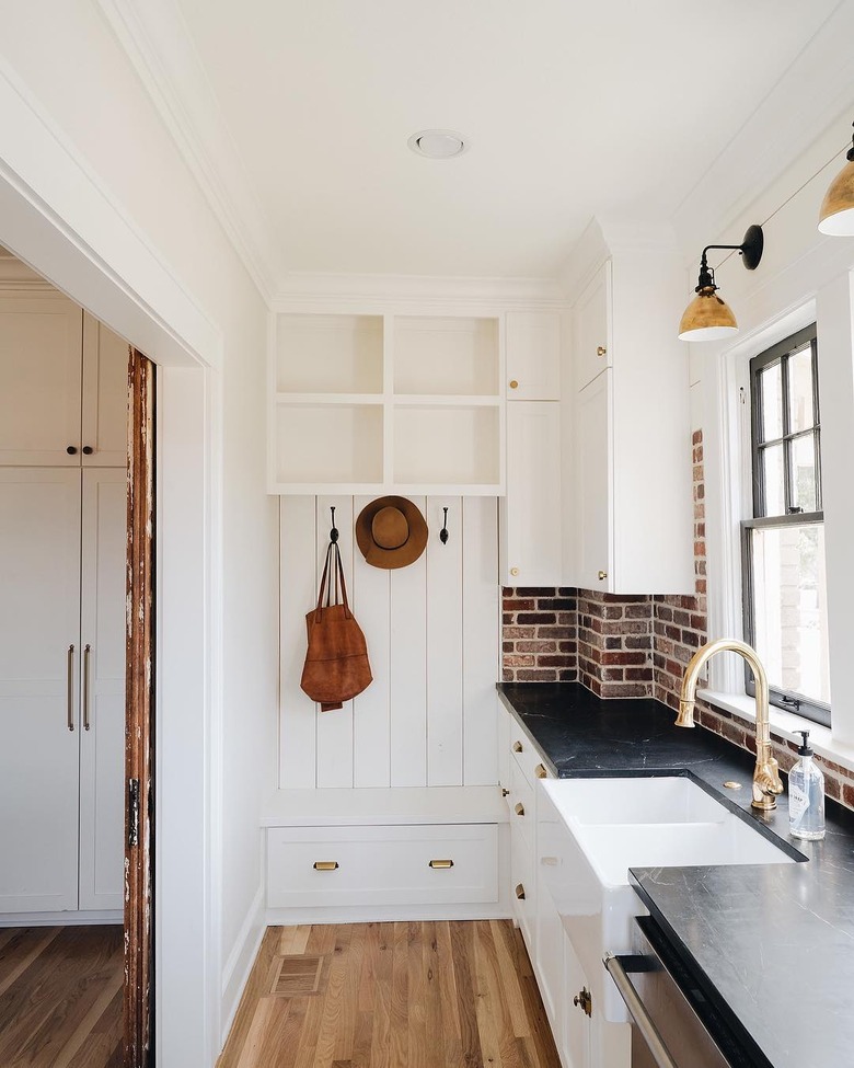 kitchen backsplash idea with brick and black countertops