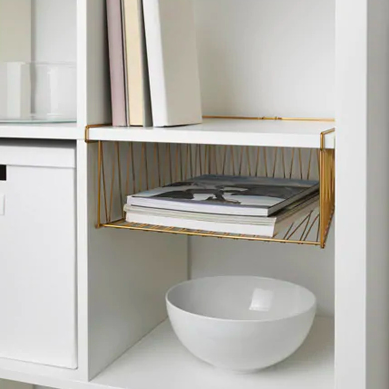 bookshelf with wire basket and white bowl