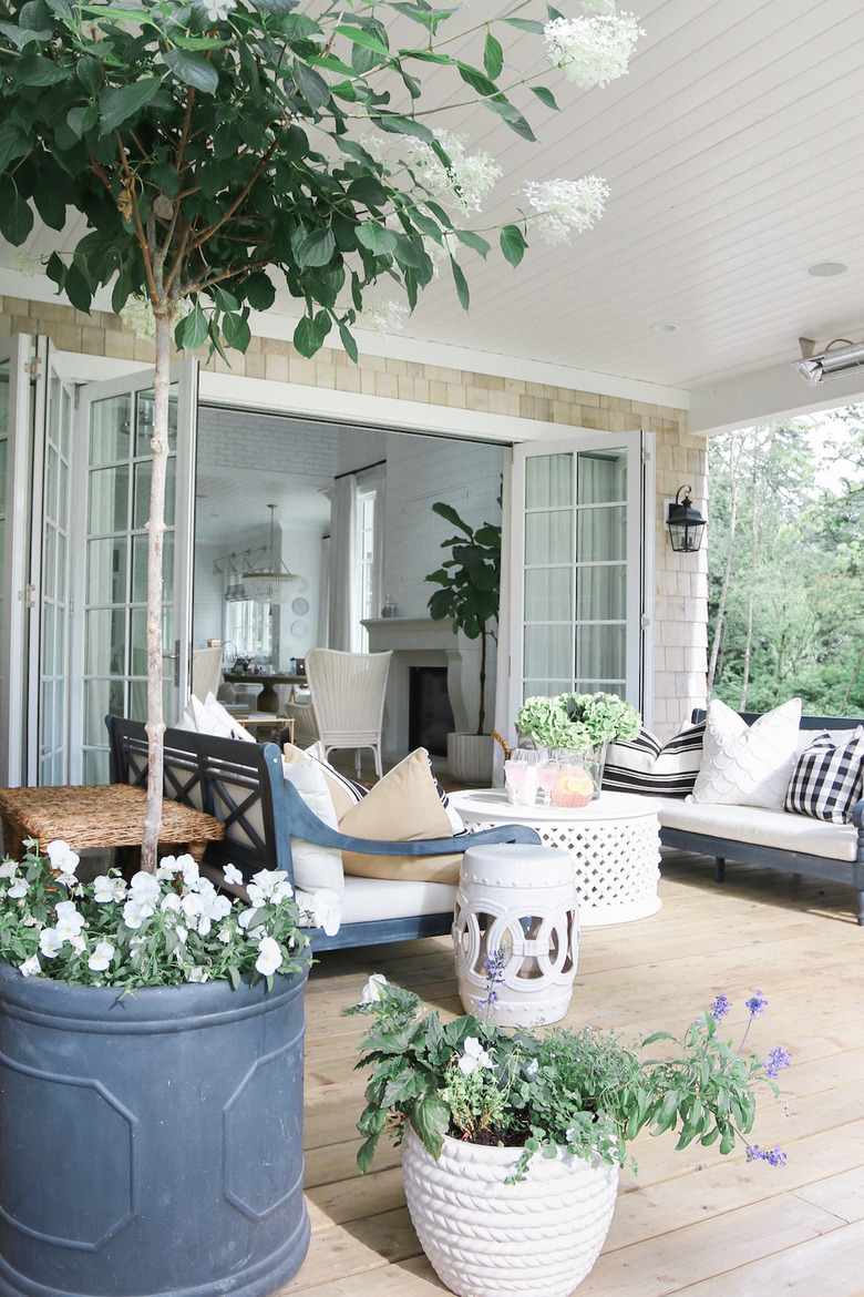 outdoor patio area with sofas and coffee table