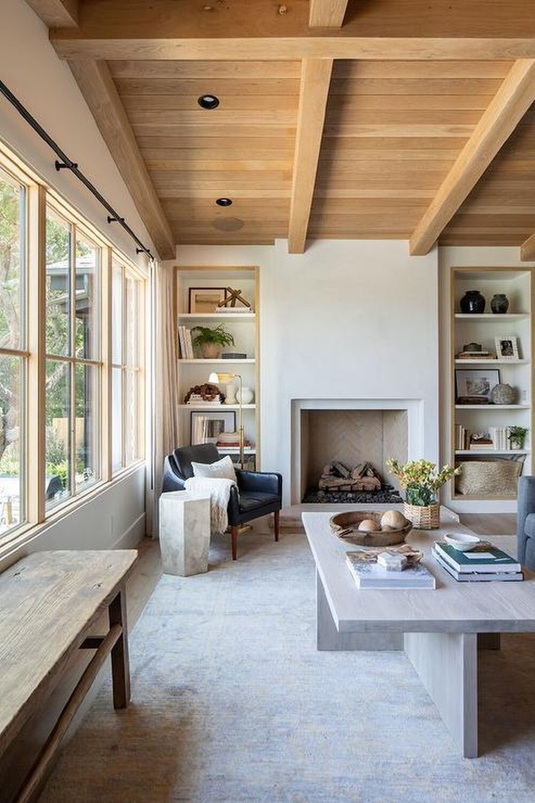 neutral living room with cross beam wood ceiling