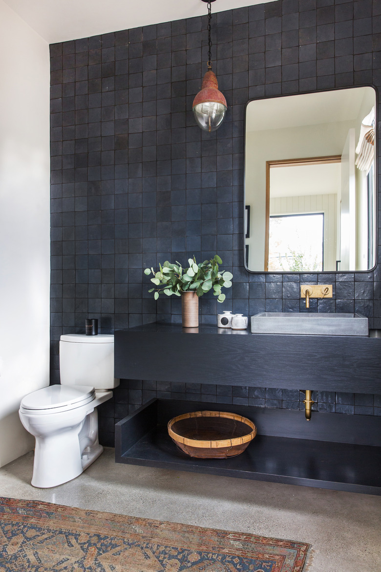 black bathroom with black vanity cabinet