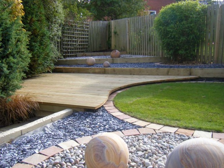 interlocking hardwood deck and grass lawn