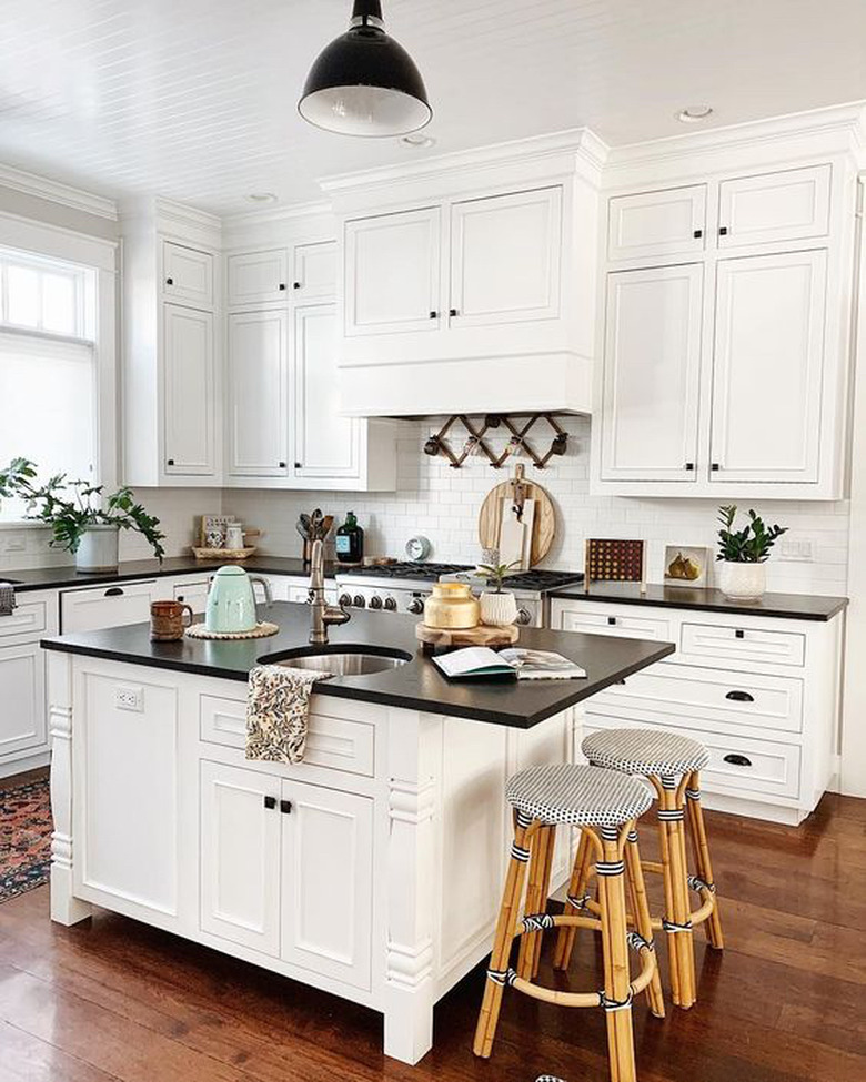 Kitchen lighting idea in white kitchen with black industrial semi-flush mount fixture