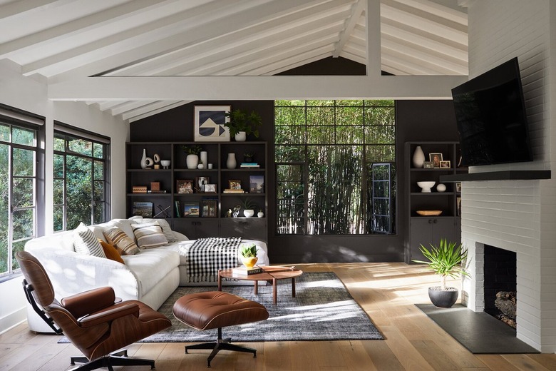 black living room with matching bookcases