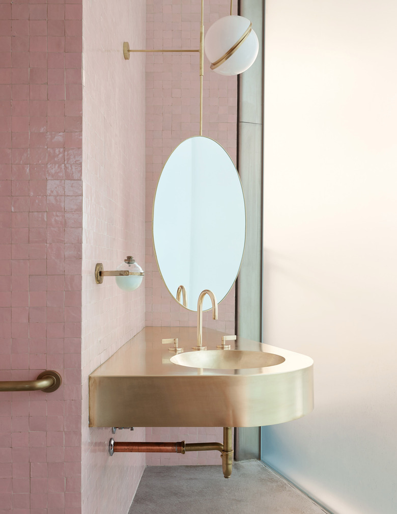 gold bathroom sink idea in pink bathroom