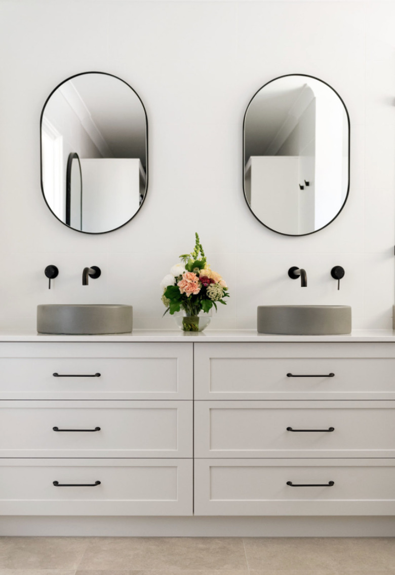 Gray concrete sink idea with gray vanity cabinet and black fixtures