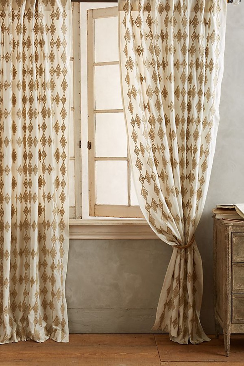 diamond pattern curtain near open window